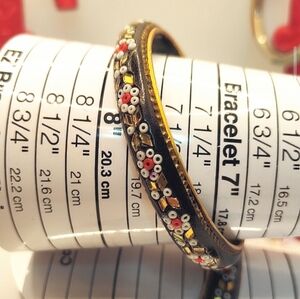 Vintage India beaded black bangle bracelet. Micro mosaic flower pattern.